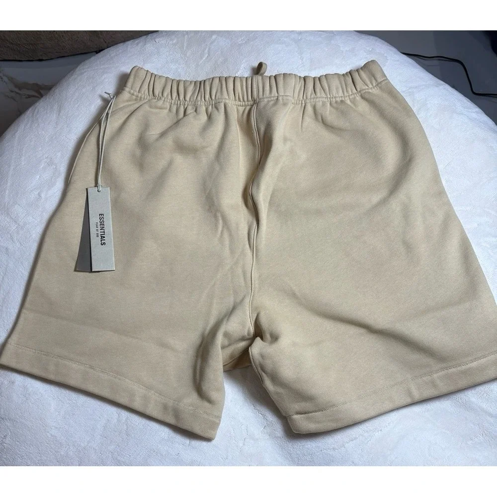 Men's medium Fear of God Essentials baggy sand colored sweat shorts. NEW.